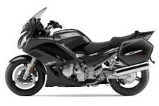 New 2015 YAMAHA FJR1300A LIQUID GRAPHITE The FJR1300A offers Yamaha leading-edge sportbike technology that lets you tour long distance with class-leading performance and comfort. The FJR1300A boasts lots of features sure to grab the attention of many riders. The aggressive styling, including the headlight cowl and side fairing, are not only great looking, they also help improve comfort and aid in weather protection.
Riders can select D-mode (Drive-mode) for varying mappings, giving the motorcycle exceptional versatility. This works in conjunction with YCC-T® (Yamaha Chip Controlled Throttle), generating engine character that can be sportier or more relaxed depending on riding situations. Traction control developed from MotoGP® technology is standard on the FJR1300A. While engaged, the system detects wheel spin and adjusts ignition timing, fuel injection volume, and throttle opening to help maintain traction. The system is designed to let the operator ride on roads that have limited traction with more confidence.
Another feature now standard on the FJR1300A is cruise control. Riders can set cruising speed with the push of a button on the left handlebar to provide comfort and ease on extended road trips. A three-part instrument panel provides riders with all the information they need while enjoying the road. Riders can easily customize the display to show the information they want. LED front turn signals/position lights give the FJR1300A the modern, high-tech look sport touring riders want.
A pushbutton-adjustable windscreen and a thick comfy seat for two are perfect for comfortable, long-distance riding. FJR1300A includes a two-position adjustable rider seat, low for shorter riders or nearly 1-inch higher for a more spacious feel for taller riders, plus handlebars that can be adjusted to one of three different positions. The result is a superb, custom-fit ride.