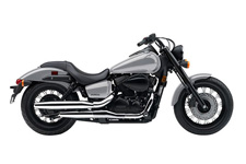 New 2015 HONDA SHADOW PHANTOM LIGHT SILVER METALLIC Embrace Your Dark Side.
If you want people to listen to you, a whisper can be louder than a shout. That’s the idea here: If you want to stand out in a world full of chrome and bright colors, maybe more chrome isn’t the answer. Maybe less is. Take one look at the Honda Shadow Phantom® and you’re going to know that’s true. The Phantom is for riders who want a great bike, who love to ride and who want to make a powerful statement. Its blacked-out 745 cc V-twin engine, black rims with matte silver highlights, bobbed fenders, spoked wheels and beefy front fork all set it apart from most of the other customs on the road. The V-twin engine’s throaty exhaust sounds just right. And the Phantom’s slightly more upright seating position is just right for both longer rides and boulevard cruising. Best of all? That has to be the Phantom’s low price tag. It’s time to go over to the dark side—in style, on a Honda Phantom.