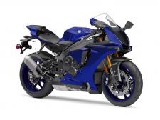 New 2018 YAMAHA YZF‑R1 TEAM YAMAHA BLUE
MotoGP®-Derived Crossplane Crankshaft Superbike
The YZF-R1® features a lightweight and compact crossplane crankshaft, inline-four-cylinder, 998cc high output engine. Featuring titanium fracture-split connecting rods, an offset cylinder block and magnesium covers, the motor delivers extremely high horsepower and a strong pulse of linear torque for outstanding performance, all wrapped in aerodynamic MotoGP®-style bodywork.
Class-Leading Electronics Package
The YZF-R1 features the most advanced electronics package ever offered on a supersport machine, with a full suite of interrelated technologies that enable the rider to enjoy the fullest range of performance with greater comfort, control, and ease of operation than ever before.
MotoGP®-Level Controllability
The YZF-R1 pioneered the use of the first six-axis Inertial Measurement Unit (IMU) ever offered on a street-going motorcycle. The IMU consists of a gyro sensor that measures pitch, roll, and yaw, as well as an accelerometer that measures acceleration in the fore-aft, up-down, and right-left directions… all at a rate of 125 calculations per second. By calculating each signal, the IMU finds the precise vehicle position and movement, and communicates it to the ECU, enabling it to control the bike’s systems.
Digital Rider Aids
The YZF-R1 is fully equipped with banking-sensitive Traction Control and unified ABS, as well as Slide Control, Launch Control, and more. For 2018, the Quick Shift System is updated to give both up and downshifting ability, automatically matching engine speed on downshifts for rapid clutchless shifts in either direction. The Wheel Lift Control system is also refined for smoother intervention and improved forward drive.
Deltabox® Chassis
Advanced aluminum Deltabox® frame uses the engine as a stressed member of the chassis and is designed to provide optimum longitudinal, lateral and torsional rigidity balance. Fully adjustable suspension front and rear provides exceptional road-holding and tuneability.
