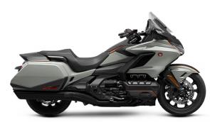 The Honda Gold Wing has always been a spectacular touring bike, ever since the first GL1000 back in 1975. And over the years, our engineers have always stayed true to that vision, but theyve strived to make the bike better and better. Our 2021 model is a perfect example of that. Refinements abound, but the best parts remain the same. Youll still have your choice of both manual-transmission models and Gold Wings featuring our exclusive automatic DCT transmission, but this year the trunk is bigger for more road-trip storage, the speakers have a higher 55-watt rating, and the passenger seat on our Tour models is improved. We also freshened up some styling touches, like solid red tail lights and paint choices. Check out the grey with orange accent stripe on our no-trunk models! Plus, all Gold Wings are now Android Auto compatible, as well as offering Apple CarPlay. All in all, a truly great motorcycle gets even better; so your dream ride has everything youll need to make memories that last a lifetime.
