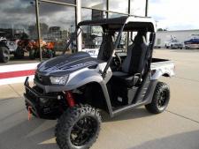 New 2018 KYMCO UXV 700I LE EPS The 2018 KYMCO UXV 700i LE EPS is an evolution of KYMCO’s popular, practical side by side, with the added features of: Electronic Power Steering (EPS); alloy wheels; and 3,000-lb. winch. Also standard: 695cc four-valve, liquid cooled, single-cylinder engine, automatic CVT with H-L-N-R-P on-demand; 2WD/4WD differential lock; independent front and rear suspension; hydraulic-assist 440-lb. capacity dump bed; 1200 lb. towing capacity; two-inch receiver; under-seat and under-hood storage; digital gauges; New for 2018: Kaifa gas-reservoir shocks with three way adjustment; high-clearance curved front A-arms; improved CVT-drive; redesigned roll cage for increased headroom; high-back bucket seats; adjustable driver seat; improved seat belts with shock reduction shoulder harness and safety interlock switch; sport steering wheel; improved hand-brake lever; new graphics. Colors are Matte Grey.