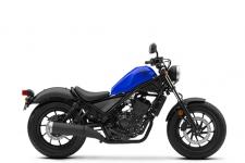 New 2018 HONDA REBEL 300 CANDY LIGHTNING BLUE TAKE THIS BIKE TO NEW PLACES.
You might say this bike is the ultimate balance of performance and style. Designed for riders of all skill levels, it’s equipped with a sporty engine and has an optimal lean angle so it rides great. It also looks terrific with its blacked-out touches, compact frame and low-slung seat. And this year, it’s available in a stunning Candy Lightning Blue. As perfect as the Rebel 300 seems stock, it’s going to be hard to resist making a few tweaks. We say go for it. 246697