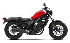 New 2018 HONDA REBEL 300 RED TAKE THIS BIKE TO NEW PLACES.
You might say this bike is the ultimate balance of performance and style. Designed for riders of all skill levels, it’s equipped with a sporty engine and has an optimal lean angle so it rides great. It also looks terrific with its blacked-out touches, compact frame and low-slung seat. And this year, it’s available in a stunning Candy Lightning Blue. As perfect as the Rebel 300 seems stock, it’s going to be hard to resist making a few tweaks. We say go for it. 246698