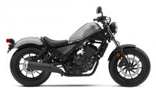 New 2018 HONDA REBEL 300 MATTE METALLIC SILVER TAKE THIS BIKE TO NEW PLACES.
You might say this bike is the ultimate balance of performance and style. Designed for riders of all skill levels, it’s equipped with a sporty engine and has an optimal lean angle so it rides great. It also looks terrific with its blacked-out touches, compact frame and low-slung seat. And this year, it’s available in a stunning Candy Lightning Blue. As perfect as the Rebel 300 seems stock, it’s going to be hard to resist making a few tweaks. We say go for it. 246694