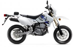 Suzukis 2022 SuperMoto DR-Z400SM is based on the proven DR-Z400S. So it combines Supermotard style and features in a narrow, lightweight, street-legal package. This bike brings off-road soul and fun to paved roads. Its not uncommon to take the SuperMoto down a twisty forest road, around tight canyon corners, or through commuter traffic.

Its 398cc, liquid-cooled, four-stroke engine provides strong low-rpm torque and crisp throttle response for any of these occasions. Key differences between the DR-Z400SM and the DR-Z400S are the inverted front fork, wide, spoke-style wheels, and 300mm diameter floating front brake rotor. The inverted fork contributes to less unsprung weight and improved overall handling, while the large brake and wider rims with high-grip tires offer an exhilarating sportbike experience.