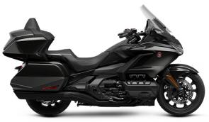 The Honda Gold Wing has always been a spectacular touring bike, ever since the first GL1000 back in 1975. And over the years, our engineers have always stayed true to that vision, but theyve strived to make the bike better and better. Our 2021 model is a perfect example of that. Refinements abound, but the best parts remain the same. Youll still have your choice of both manual-transmission models and Gold Wings featuring our exclusive automatic DCT transmission, but this year the trunk is bigger for more road-trip storage, the speakers have a higher 55-watt rating, and the passenger seat on our Tour models is improved. We also freshened up some styling touches, like solid red tail lights and paint choices; check out the grey with orange accent stripe on our no-trunk models! Plus, all Gold Wings are now Android Auto compatible, as well as offering Apple CarPlay. All in all, a truly great motorcycle gets even better; so your dream ride has everything youll need to make memories that last a lifetime.
