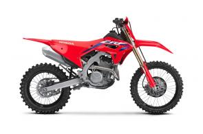 TRAIL-READY MOTOCROSS PERFORMANCE
Talk about the best of both worlds: the 2023 Honda CRF250RX gives you motocross performance in a bike that’s specially tailored to desert races, enduros, and demanding trails. Tailored how? With different gearbox ratios, an 18-inch rear wheel, special engine settings, handguards, a sidestand, a larger fuel tank, and more. We gave this bike a major upgrade last year, and it’s been racking up trophies ever since. Like the pure-motocross CRF250R, the RX features a double-overhead-cam engine, fuel injection, an all-aluminum chassis, and state-of-the-art Showa suspension. Anyplace where power, precision, light weight and nimble handling is at a premium, this is the bike you’ll want to be riding.