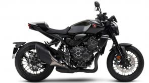 A streetfighter is a modern sportbike with abundant raw horsepower, minimal bodywork, and plenty of attitude. That describes our Honda CB1000R Black Edition perfectly. Nothing gets between you and the pure essentials of the riding experience. Its high-revving liter-class four-cylinder engine is specially tuned for midrange and top-end power. The seating position is a little more open and relaxed than most pure sportbikes. And its graphic treatment is as powerful as its engine: black on black, understated yet elegant, and touched with some machined highlights. Modern touches include features like a digital instrument display, under-seat USB port, and a quick shifter. Are you ready to ride this awesome beast? We thought so.
CB1000RA
