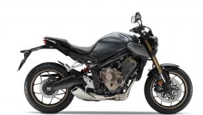 Want to know the difference between our CBR650R and the CB650R (other than that one little letter)? First you’ll notice the CB650R showcases its engine front and center, uncovered by any bodywork. Next, check out the seating position, especially the taller handlebar. That really opens up the cockpit, letting you sit up a little straighter, especially welcome if you’re riding around in town or at a more relaxed pace. They may seem like small things, but they all add up to a bike that is a real decathlon champion, a machine with an incredibly wide range where it shines. Great suspension, a responsive chassis, anti-lock brakes, six-speed transmission and comfortable rider accommodations: While there’s no such thing as a one-size-fits-all motorcycle, the 2023 CB650R comes awfully close.
CB650RA