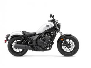 The Honda Rebel 500 is a bike that breaks out from the world of traditional motorcycle style and escapes from the boring boulevard drone. It all starts with a narrow 471cc twin-cylinder engine with plenty of user-friendly power. The blacked-out look, light weight, and low seat height are winners everywhere, and features like Honda�s slip/assist clutch help make riding more enjoyable. And where some cruiser-class bikes are only fun if you ride slow, the Rebel 500 is happy to kick it up a notch. You can even get anti-lock brakes. Plus, for 2021, we�ve added fresh new colors, and our new Rebel 500 ABS SE, a version that comes with a selection of some of our most popular accessories, pre-installed, like our Black Diamond-Stitch Seat, Black Fork Boots and Covers, and a Black Headlight Cowl. So don�t let anyone put you into a cage�discover a new Rebel 500 and escape the ordinary.