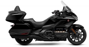 The open road is calling, and it always has been. Humans are just hard-wired to explore, to want to see what’s over the horizon. Every motorcyclist knows the feeling. And one motorcycle makes it happen better than any other: the Honda Gold Wing. All four Gold Wing trim levels this year get updated highlight stripes and colors, as well as a navigation-system map update. But the best parts remain—the famously smooth 1833cc six-cylinder engine, refined bodywork for weather protection, and ample luggage. Full of innovative engineering, all Gold Wing models are Android Auto™ compatible, as well as offering Apple CarPlay™ compatibility. You can choose between a conventional six-speed transmission and our exclusive Honda automatic seven-speed DCT transmission, depending on the model. So go ahead—isn’t it time you experience the gold standard of touring bikes?
GL1800