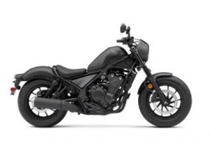 The Honda Rebel 500 is a bike that breaks out from the world of traditional motorcycle style and escapes from the boring boulevard drone. It all starts with a narrow 471cc twin-cylinder engine with plenty of user-friendly power. The blacked-out look, light weight, and low seat height are winners everywhere, and features like Honda�s slip/assist clutch help make riding more enjoyable. And where some cruiser-class bikes are only fun if you ride slow, the Rebel 500 is happy to kick it up a notch. You can even get anti-lock brakes. Plus, for 2021, we�ve added fresh new colors, and our new Rebel 500 ABS SE, a version that comes with a selection of some of our most popular accessories, pre-installed, like our Black Diamond-Stitch Seat, Black Fork Boots and Covers, and a Black Headlight Cowl. So don�t let anyone put you into a cage�discover a new Rebel 500 and escape the ordinary.
